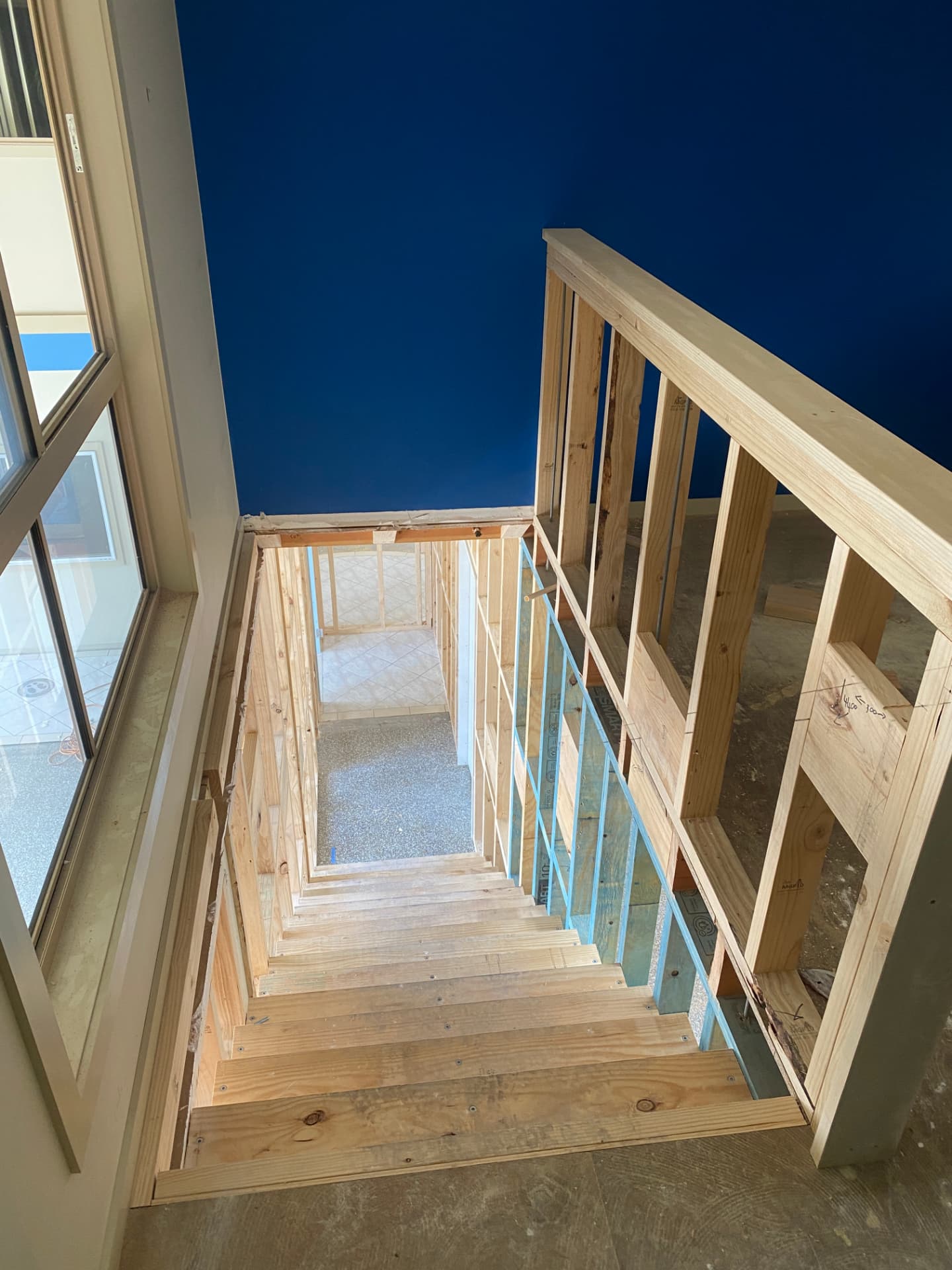 Timber staircase viewed from the upper landing